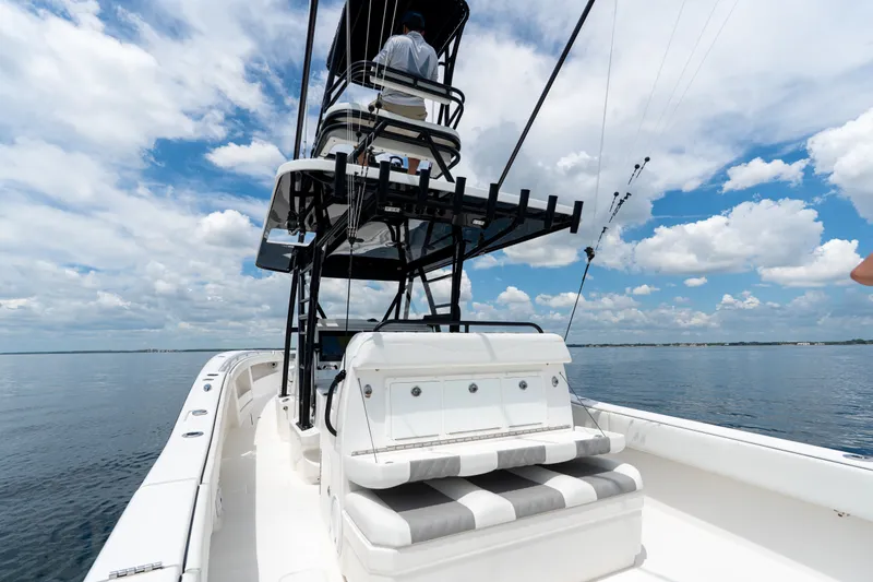 Slide: The Image of 2021 Invincible 39 Open Fisherman boat on calm waters under a cloudy sky. - 26