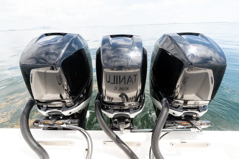 Slide: The Image of Triple outboard engines on a 2021 Invincible 39 Open Fisherman boat. - 35