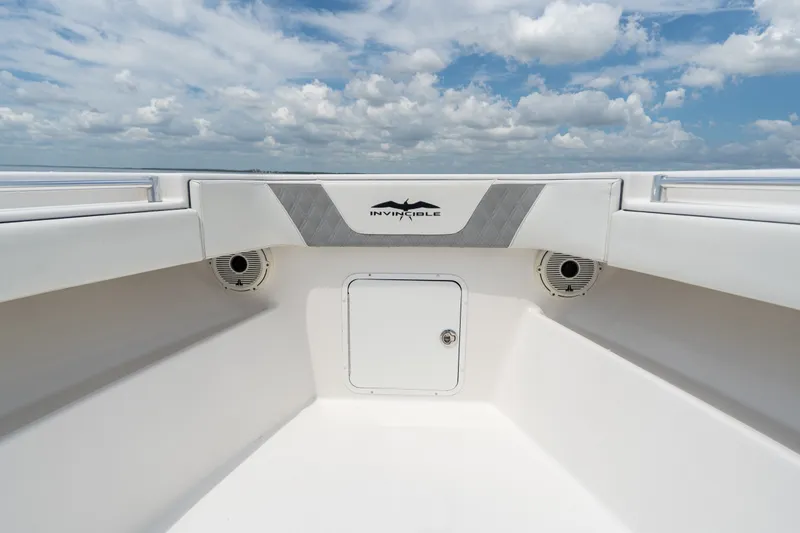 Slide: The Image of 2021 Invincible 39 Open Fisherman boat interior with speakers and storage compartment. - 19