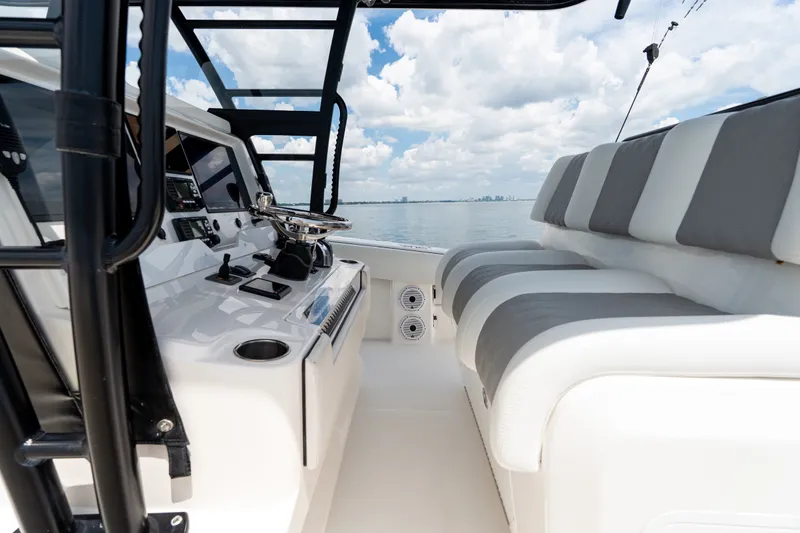 Slide: The Image of 2021 Invincible 39 Open Fisherman boat interior with modern helm and seating. - 49