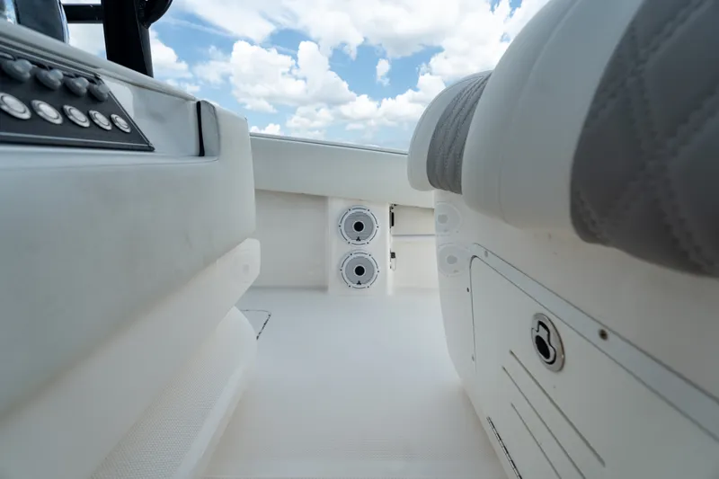 Slide: The Image of Interior view of 2021 Invincible 39 Open Fisherman boat, featuring seating and control panel. - 34