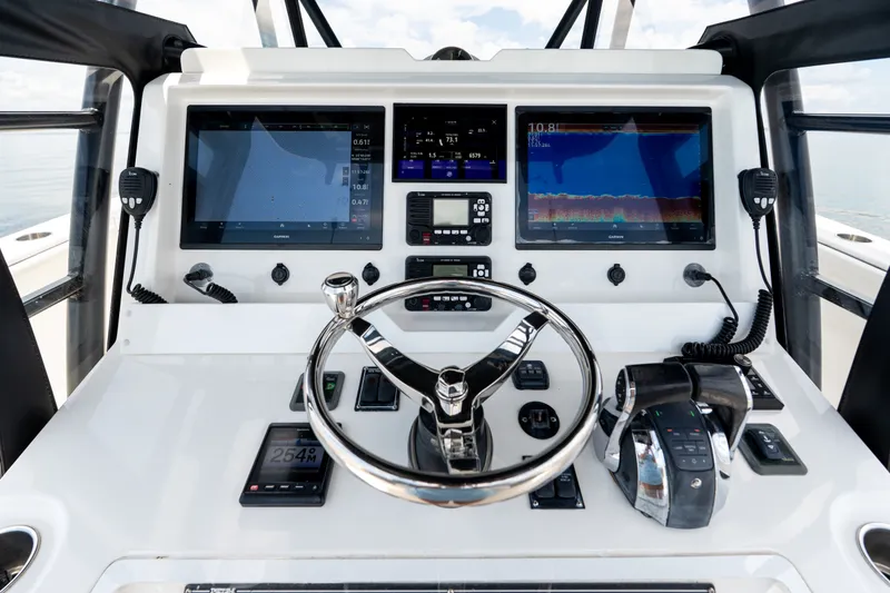 Slide: The Image of Control panel of 2021 Invincible 39 Open Fisherman boat with advanced navigation displays. - 13