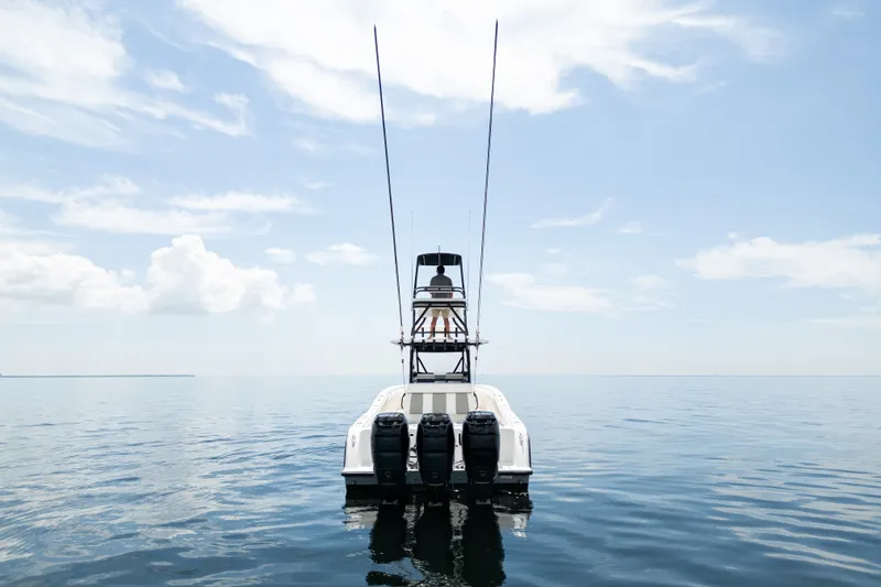 Slide: The Image of 2021 Invincible 39 Open Fisherman boat on calm ocean waters under blue sky. - 9