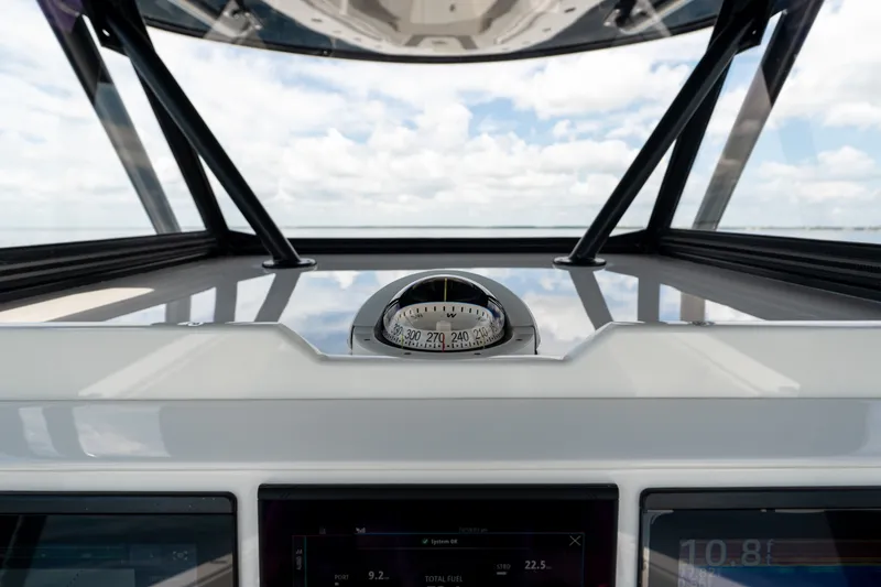 Slide: The Image of 2021 Invincible 39 Open Fisherman helm with compass and navigation display. - 15