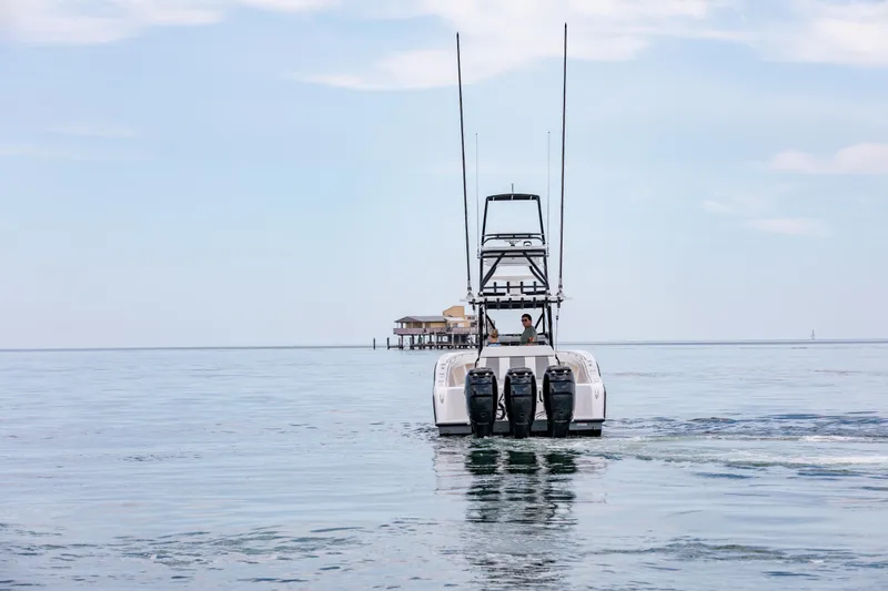 Slide: The Image of 2021 Invincible 39 Open Fisherman boat cruising on calm waters. - 67