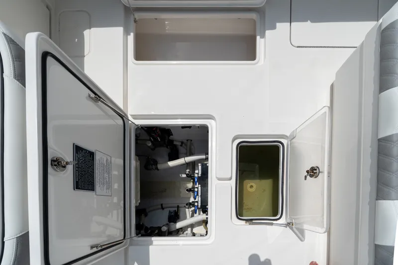 Slide: The Image of 2021 Invincible 39 Open Fisherman boat compartments and storage areas, showcasing interior features. - 23