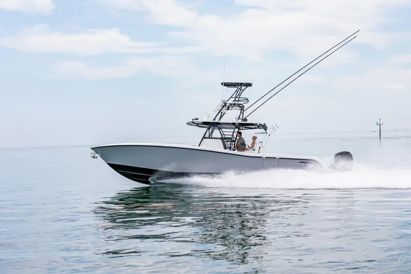 Slide: The Image of 2021 Invincible 39 Open Fisherman boat cruising on calm water. - 60