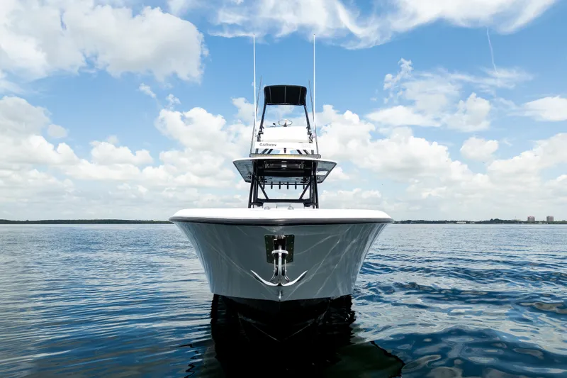 Slide: The Image of 2021 Invincible 39 Open Fisherman boat on calm water under a blue sky. - 11