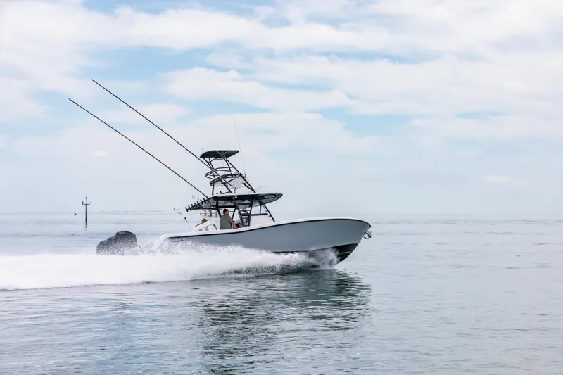 Slide: The Image of 2021 Invincible 39 Open Fisherman cruising on open water under a cloudy sky. - 63