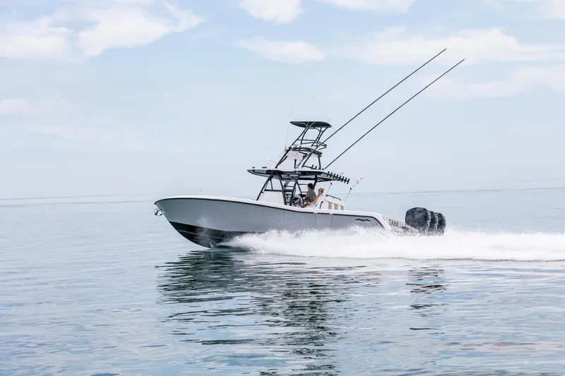 Slide: The Image of 2021 Invincible 39 Open Fisherman boat cruising on calm ocean waters. - 61