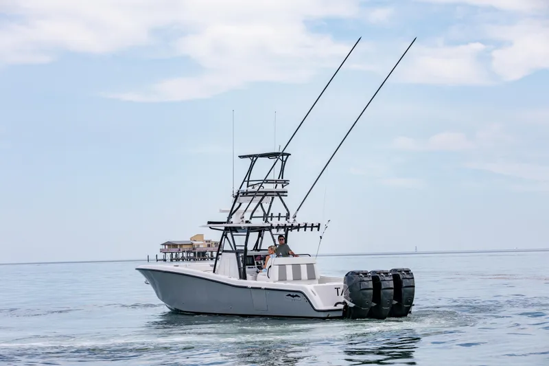 Slide: The Image of 2021 Invincible 39 Open Fisherman boat on calm water with clear sky. - 66