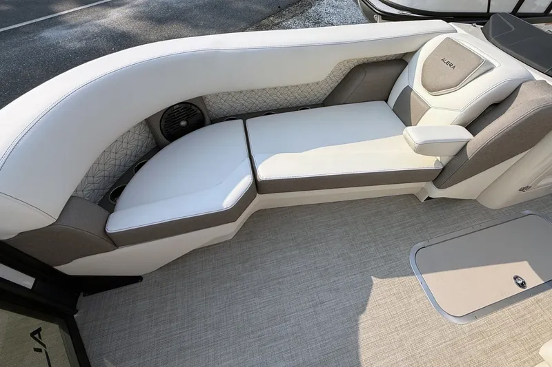 Slide: The Image of Luxurious seating in 2027 Alera M25L boat, featuring elegant white and gray upholstery. - 13