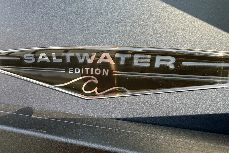 Slide: The Image of 2027 Alera M25L Saltwater Edition emblem on metallic surface. - 4