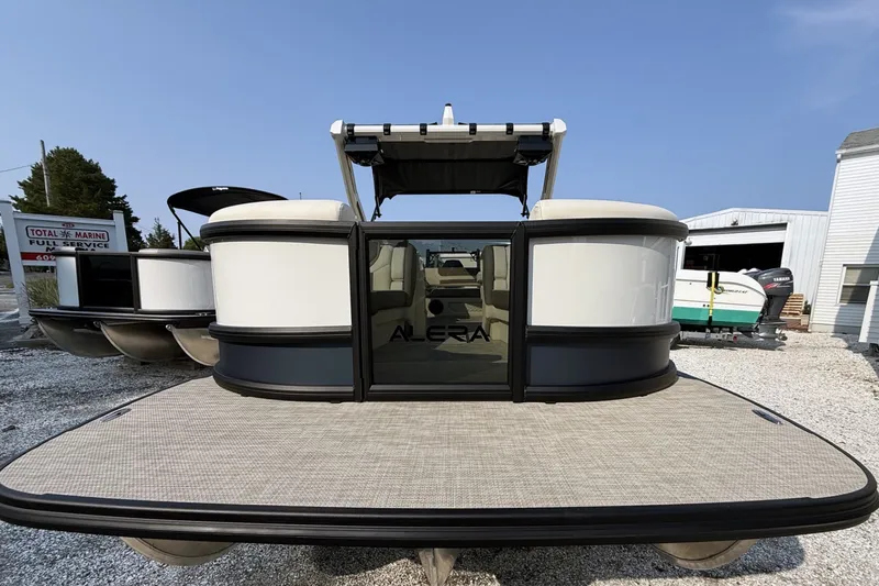 Slide: The Image of 2027 Alera M25L pontoon boat at marina, front view. - 5