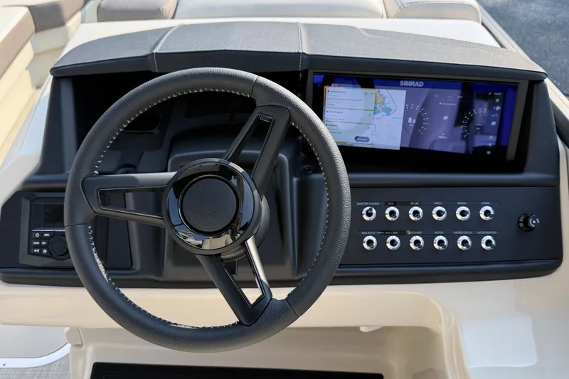 Slide: The Image of Steering wheel and dashboard of 2027 Alera M25L boat with control panel and display. - 9