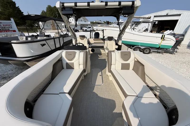 Slide: The Image of 2027 Alera M25L boat interior with luxurious seating and modern design. - 11