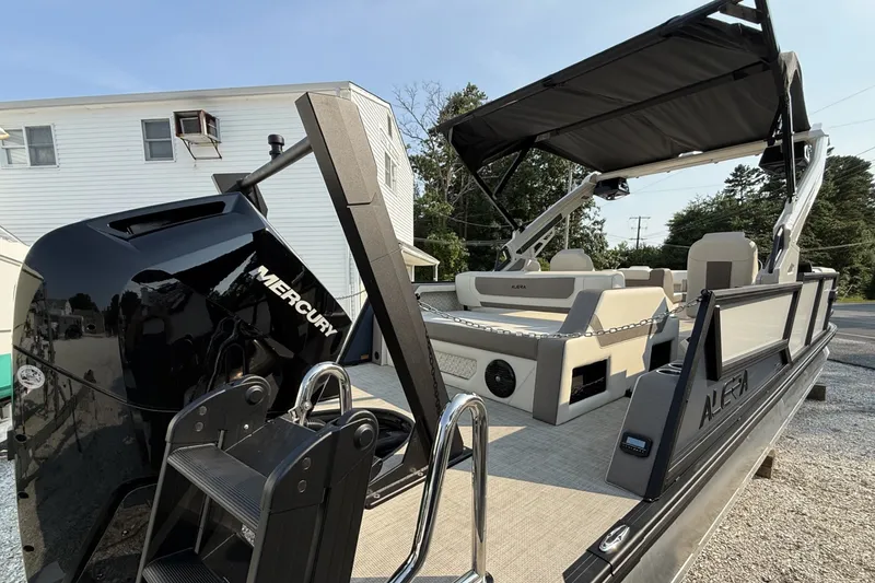 Slide: The Image of 2027 Alera M25L boat with Mercury engine, featuring spacious seating and modern design. - 6