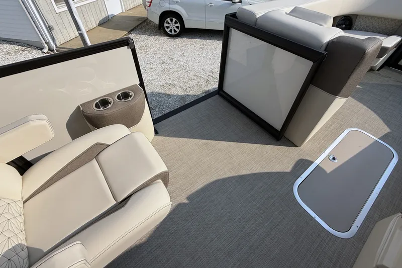 Slide: The Image of Luxurious interior of 2027 Alera M25L boat with beige seating and cup holders. - 16