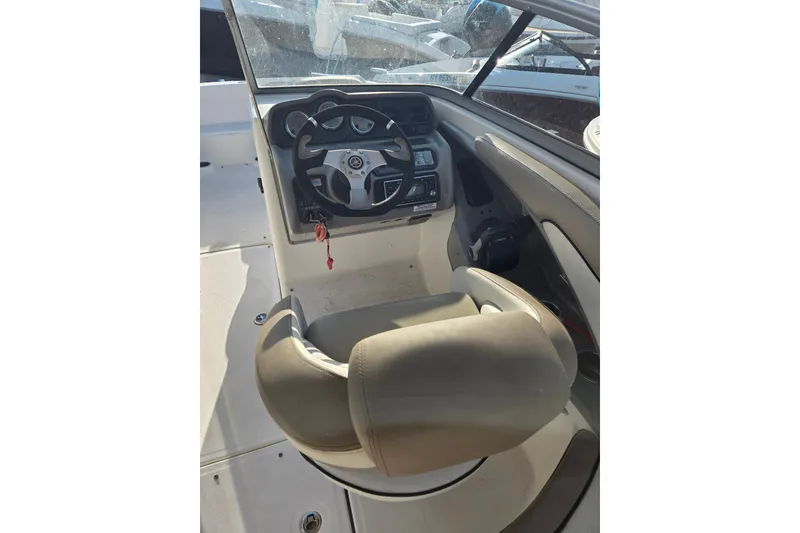 Slide: The Image of 2011 Yamaha Boats 242 Limited cockpit with steering wheel and controls. - 6