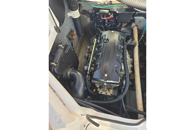 Slide: The Image of Engine compartment of a 2011 Yamaha Boats 242 Limited, showcasing the engine components. - 15