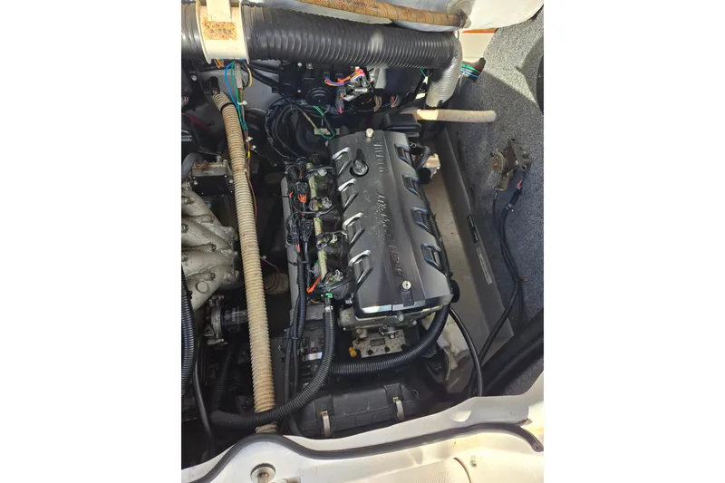 Slide: The Image of Engine compartment of a 2011 Yamaha Boats 242 Limited, showcasing detailed components. - 16