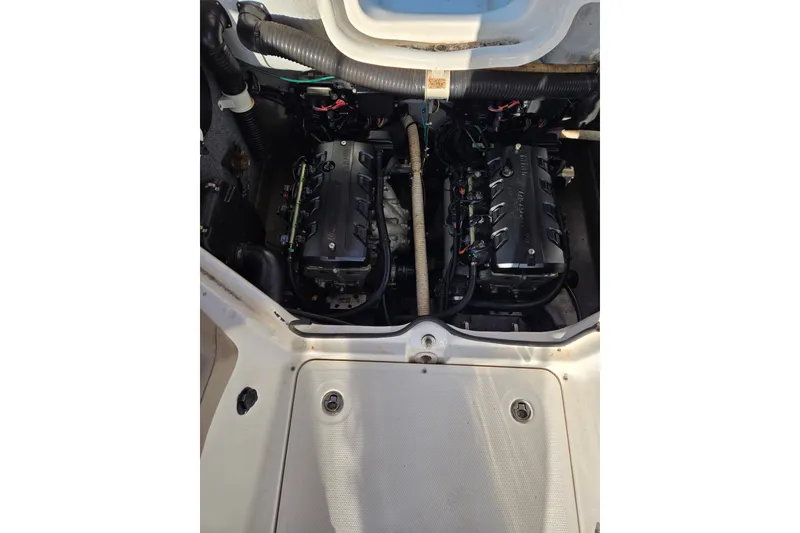 Slide: The Image of Engine compartment of a 2011 Yamaha Boats 242 Limited, showcasing dual engines. - 14