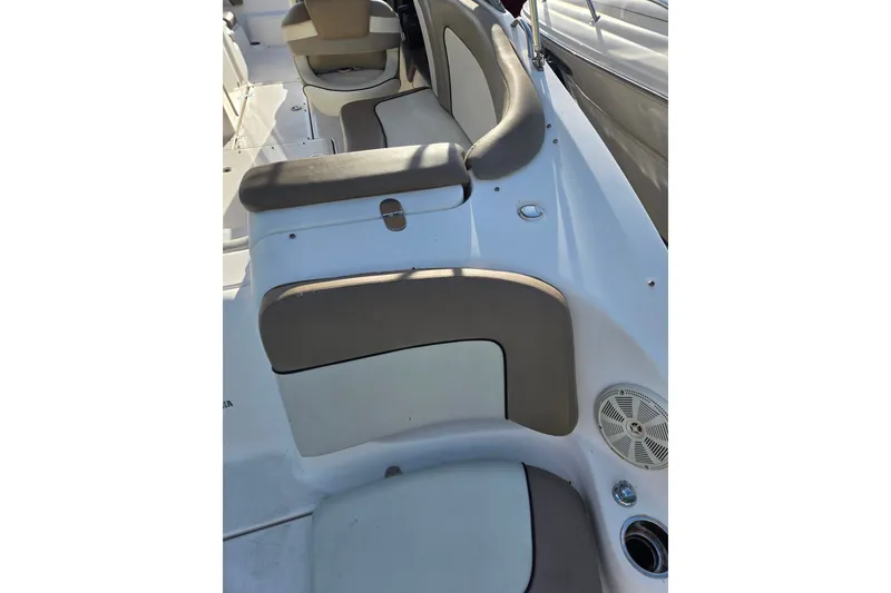 Slide: The Image of Interior seating of 2011 Yamaha Boats 242 Limited, featuring beige and white upholstery. - 4