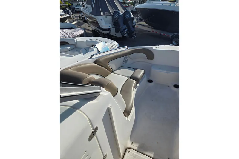 Slide: The Image of 2011 Yamaha Boats 242 Limited interior with cushioned seating and sleek design. - 8