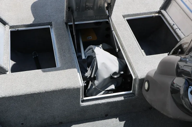 Slide: The Image of 2018 Tracker Pro Team 175 TXW boat storage compartments open. - 29