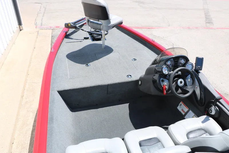 Slide: The Image of 2018 Tracker Pro Team 175 TXW boat interior with steering console and seating. - 21