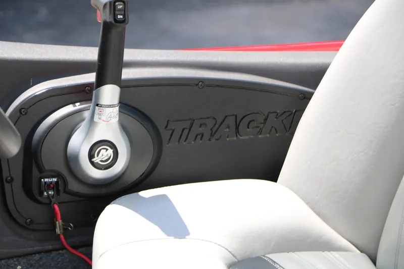 Slide: The Image of 2018 Tracker Pro Team 175 TXW boat interior with control lever and seat. - 18