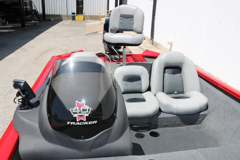 Slide: The Image of 2018 Tracker Pro Team 175 TXW boat interior with gray seating and control panel. - 25