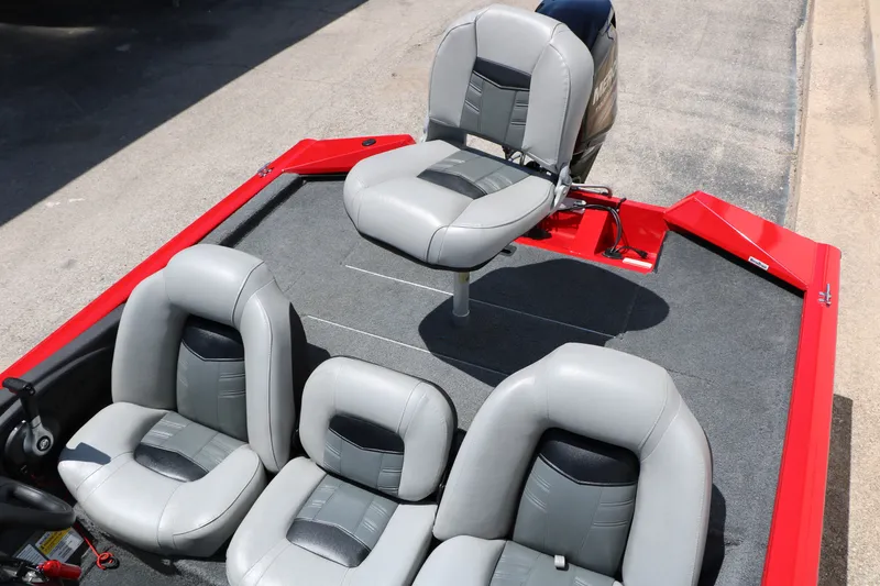 Slide: The Image of 2018 Tracker Pro Team 175 TXW boat interior with gray seating and red accents. - 26