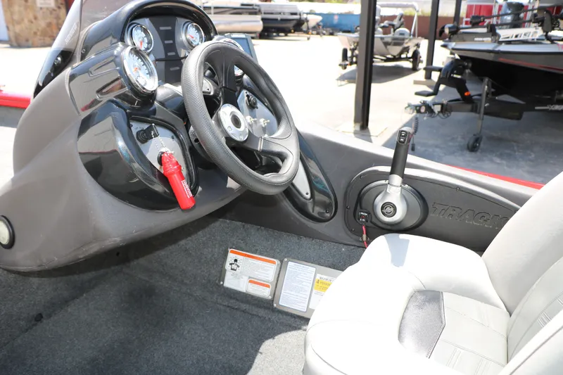 Slide: The Image of 2018 Tracker Pro Team 175 TXW boat interior with steering wheel and control panel. - 32
