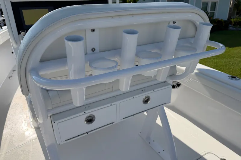 Slide: The Image of 2024 Bluewater BW 25T boat console with rod holders and storage drawers. - 43