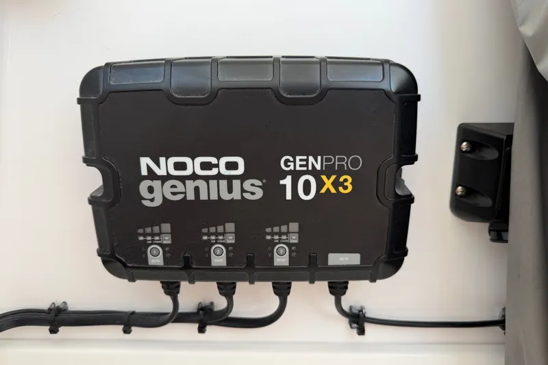 Slide: The Image of NOCO Genius GENPRO 10X3 charger installed on 2024 Bluewater BW 25T boat. - 54