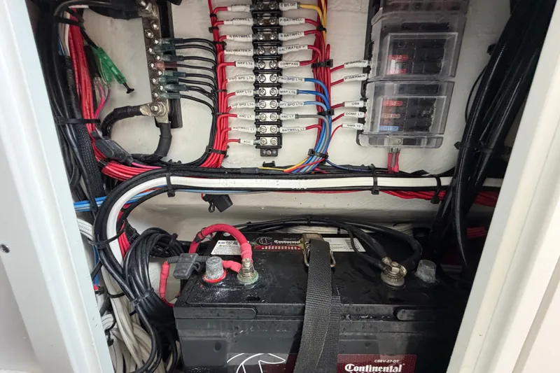 Slide: The Image of Electrical wiring and battery setup in 2024 Bluewater BW 25T boat. - 58