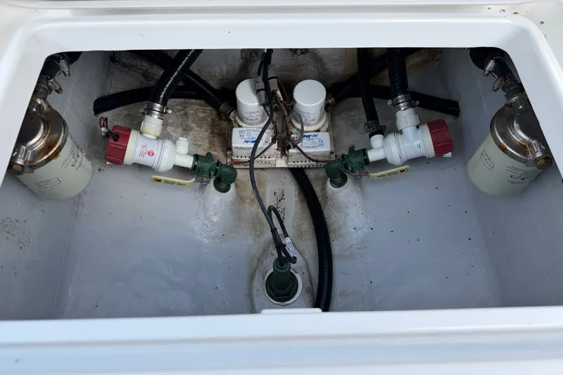 Slide: The Image of 2024 Bluewater BW 25T boat engine compartment with fuel filters and hoses. - 48
