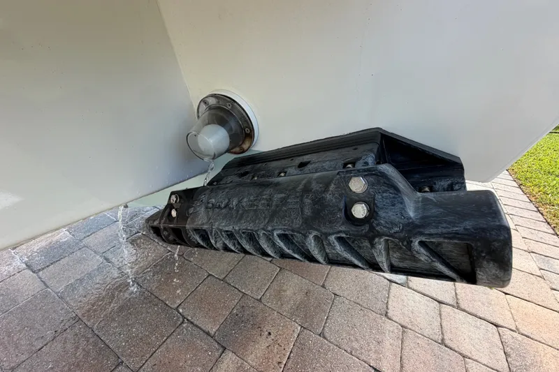 Slide: The Image of 2024 Bluewater BW 25T boat hull with water drainage on brick pavement. - 60