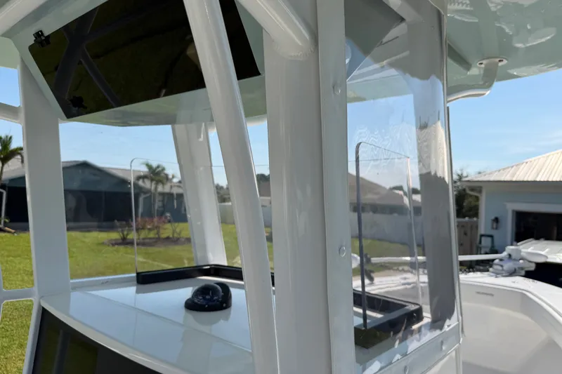 Slide: The Image of 2024 Bluewater BW 25T boat console with compass, showcasing sleek design and modern features. - 16