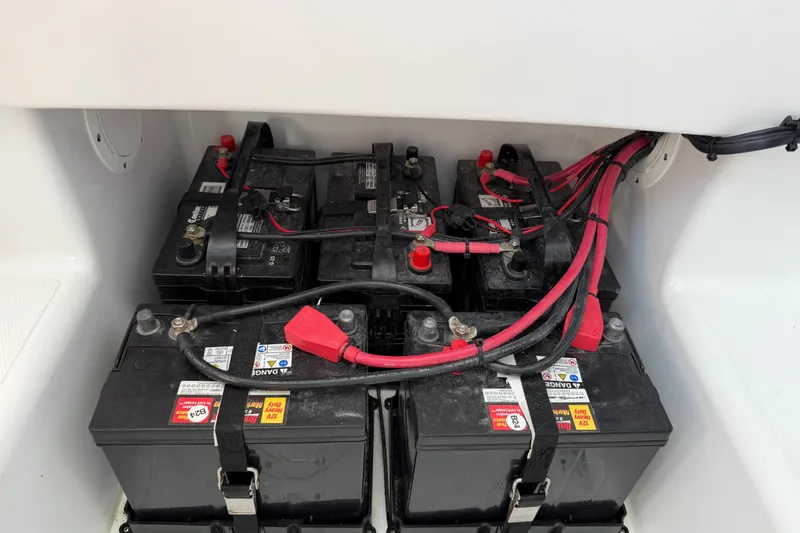 Slide: The Image of 2024 Bluewater BW 25T boat battery compartment with multiple connected batteries. - 53