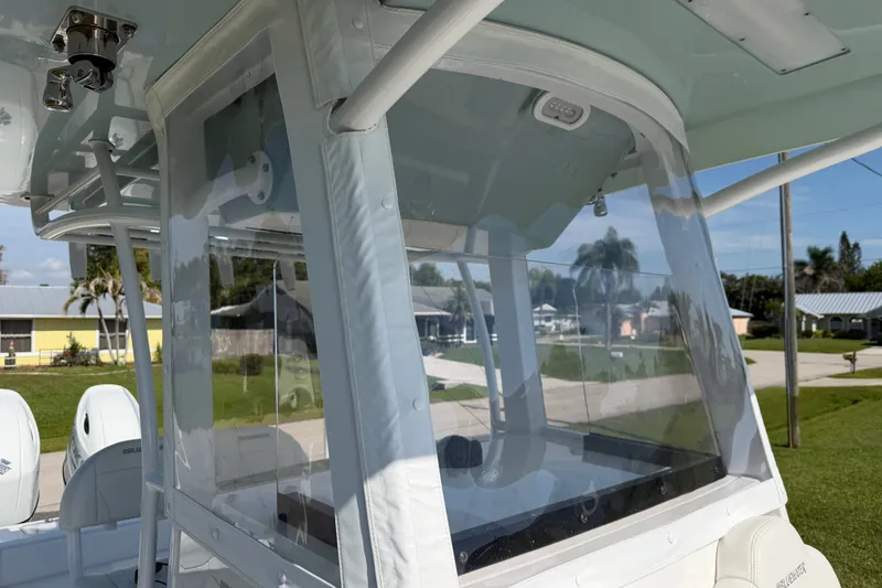 Slide: The Image of 2024 Bluewater BW 25T boat with clear enclosure, showcasing modern design and functionality. - 15