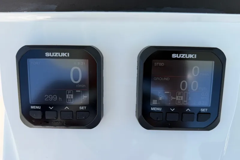 Slide: The Image of Digital displays on a 2024 Bluewater BW 25T boat, featuring Suzuki engine controls. - 38