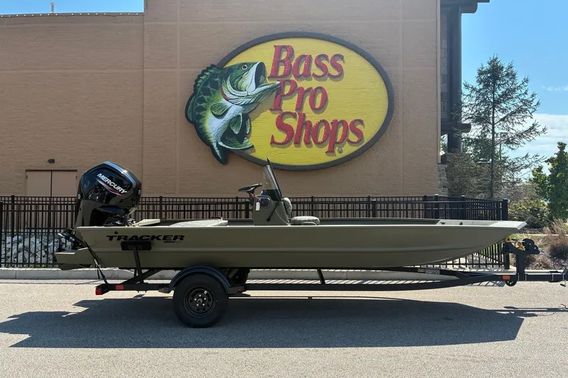 The Image of 2027 Tracker Grizzly 1860 CC boat parked outside Bass Pro Shops. - 0
