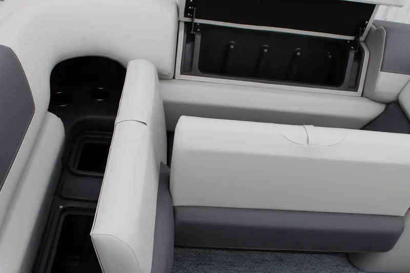 Slide: The Image of 2027 Sun Tracker Fishin' Barge 20 DLX interior seating with storage compartments. - 16