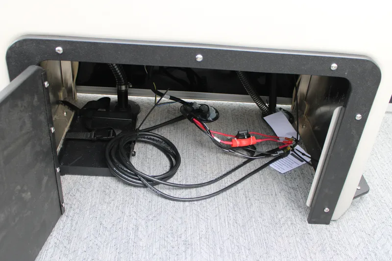 Slide: The Image of Storage compartment with wiring in 2027 Sun Tracker Fishin' Barge 20 DLX boat. - 25