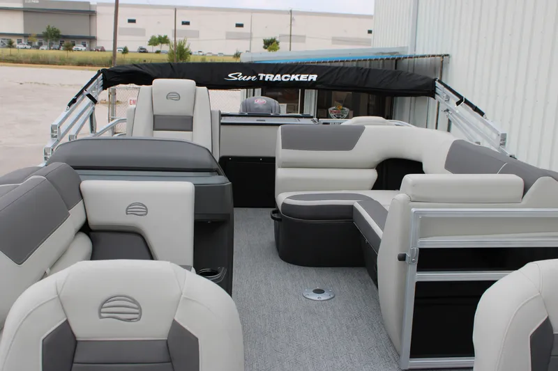 Slide: The Image of 2027 Sun Tracker Fishin' Barge 20 DLX interior with plush seating and modern design. - 20