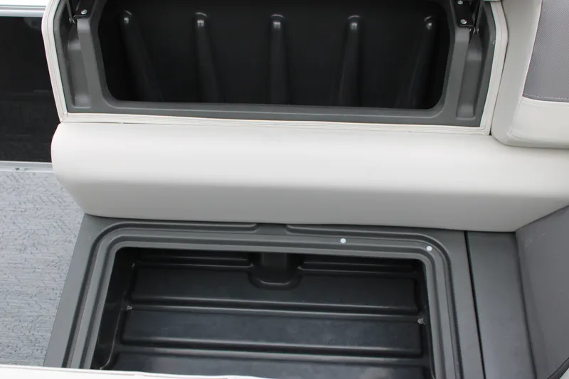 Slide: The Image of Open storage compartment on 2027 Sun Tracker Fishin' Barge 20 DLX boat. - 30