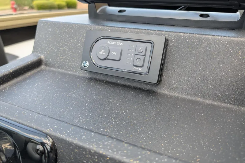 Slide: The Image of Active trim control panel on 2027 Tracker Targa V-19 Combo boat dashboard. - 15