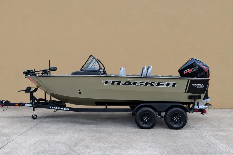 The Image of 2027 Tracker Targa V-19 Combo boat on trailer, side view against beige background. - 0
